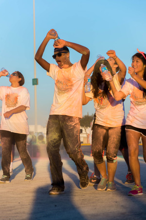 November 1, 2014 - Houston, TX, USA: Color Fun Fest 5K run. Runners completing the course with...