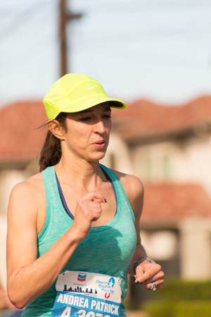 January 18, 2015 - Houston, TX, USA: Houston 2015 Marathon runners on Memorial Drive after passing mile 22のeditorial素材