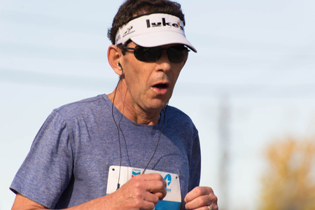 January 18, 2015 - Houston, TX, USA: Houston 2015 Marathon runners on Memorial Drive after passing mile 22のeditorial素材