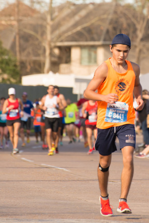 January 18, 2015 - Houston, TX, USA: Houston 2015 Marathon runners on Memorial Drive after passing mile 22のeditorial素材