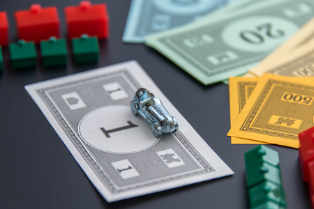 February 8, 2015 - Houston, TX, USA.  Monopoly car, money, hotels and housesのeditorial素材