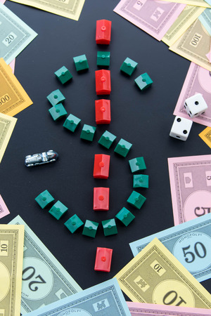 February 8, 2015 - Houston, TX, USA.  Monopoly money around houses and hotelsのeditorial素材