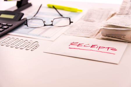 Tax preparation supplies, reading glasses and blank tax formsの写真素材