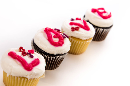 Valentines Day cupcakes with frosting letters spelling LOVEの写真素材
