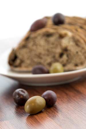 fresh baked olive bread and olivesの写真素材