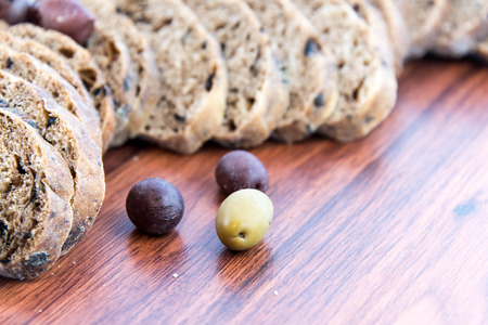 fresh baked olive bread and olivesの写真素材