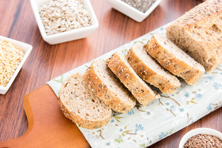 a fresh baked loaf of whole grains bread with poppy, flax adn sunflower seeds