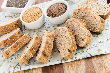 a fresh baked loaf of whole grains bread with poppy, flax adn sunflower seeds