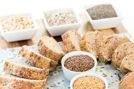 a fresh baked loaf of whole grains bread with poppy, flax adn sunflower seeds