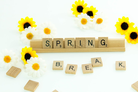 December 19, 2014: Houston, TX, USA - Scrabble word game wood tiles spelling Spring Breakのeditorial素材