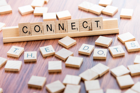 April 4, 2015: Houston, TX, USA - Scrabble Word Game wood tiles spelling Connect The Dots April 4, 2015: Houston, TX, USA - Scrabble Word Game wood tiles spelling Connect The Dots