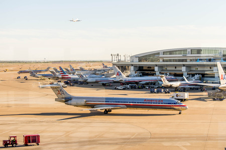 DFW, Dallas Fort Worth International Airport, Dallas, TX, USA - November 10,2014: view through a window of the airport ramp operationsのeditorial素材