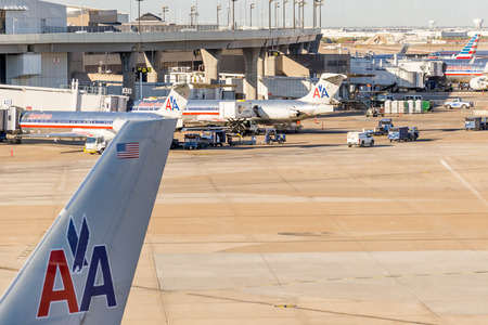DFW, Dallas Fort Worth International Airport, Dallas, TX, USA - November 10,2014: view through a window of the airport ramp operationsのeditorial素材
