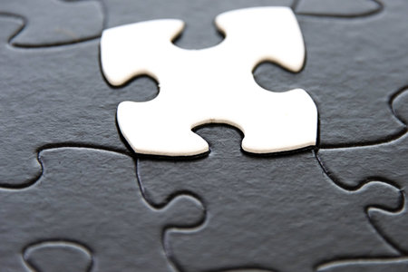 black and white puzzle pieces contrastingの写真素材