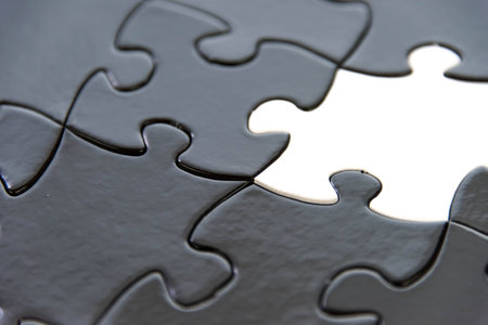 black and white puzzle pieces contrastingの写真素材