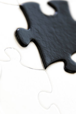 black and white puzzle pieces contrastingの写真素材