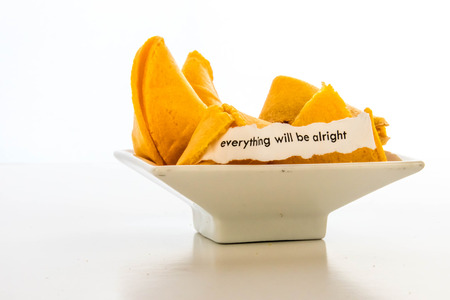 open fortune cookie with strip of white paper - EVERYTHING WILL BE ALRIGHTの写真素材