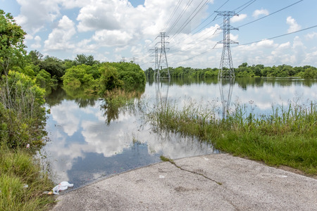 Standing flood waters over roads and fieldsの写真素材