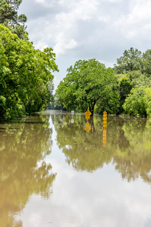 Standing flood waters over roads and fieldsの写真素材