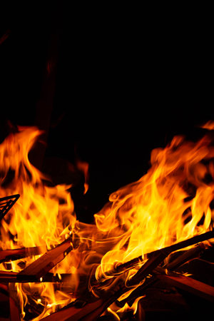 fire with a black background, Argentine roast, barbecue, party and fire, sacred ritual, grandfather...