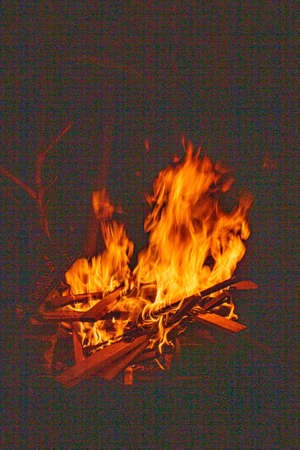 fire with a black background, Argentine roast, barbecue, party and fire, sacred ritual, grandfather...