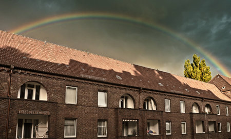 Rainbow over roofの写真素材