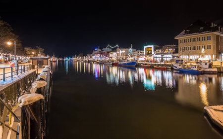 Rostock Warnemuende with snow at nightの写真素材