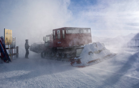 Snow Groomer in windy conditionsの写真素材