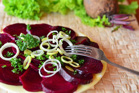 Fresh sliced  beetroot salad with onion and parsley