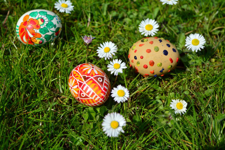 Colorful painted easter eggs on a green grass