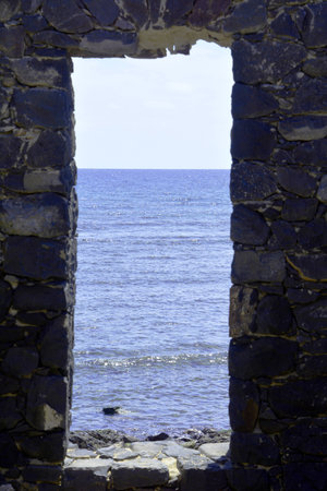 Looking through doors to wards blue sea