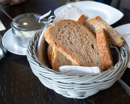 Italian ciabatta on a basket on a restaurant tableの写真素材