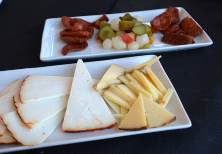 Mediterranean cuisine. Spanish tapas starters on a restaurant table.の写真素材