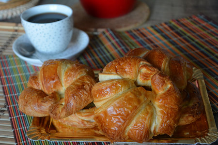 Breakfast with various of traditional French croissants, bread with chocolates, grapes on rustic.の写真素材