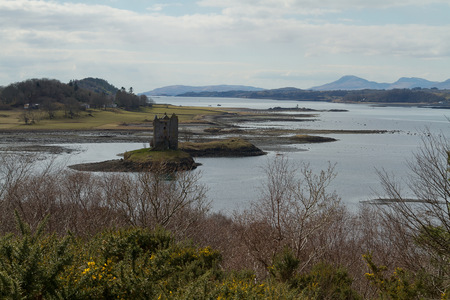 A scenic view of a scottish castle in the north of Scotland on a sunny day with limited cloudsのeditorial素材