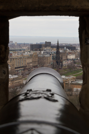 Edinburgh Scotland  circa March 2013: A view looking outward from the canon hole at Edinburgh Castle on a cloudy dayのeditorial素材