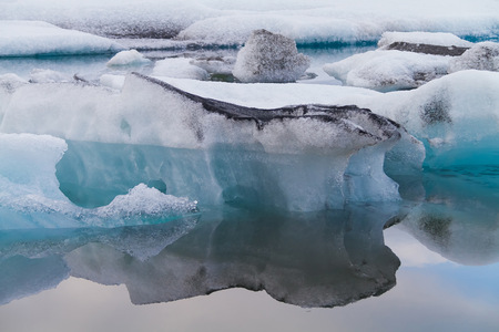 Luminous blue icebergs floating in Jokulsarlon glacial lagoon, Iceland
