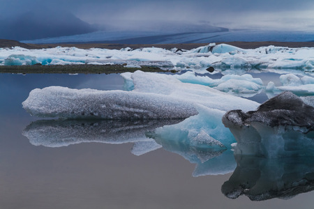 Luminous blue icebergs floating in Jokulsarlon glacial lagoon, Icelandの写真素材