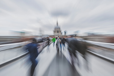 April 2016 - London, England:  Blurred photo of people crossing Millenium Footbridgeの写真素材