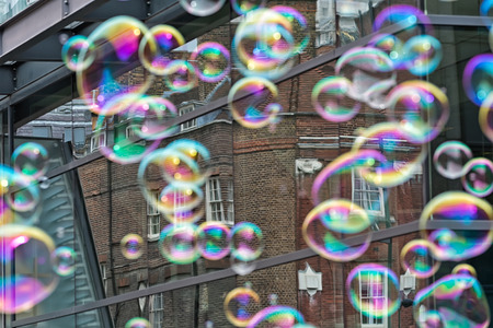 Bubbles from a street entertainer on the South Bank Londonの写真素材