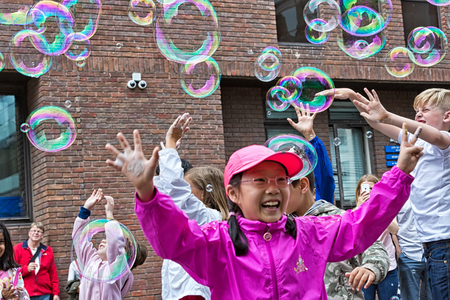 London, UK - July 2016:  Bubbles from a street entertainer, with St Paul's Cathedral in the background, on the South Bank Londonのeditorial素材