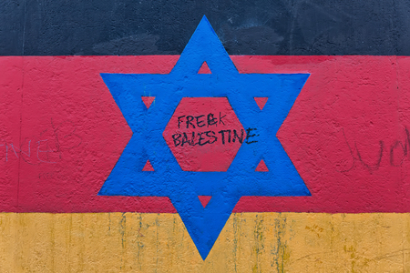 BERLIN, GERMANY - JULY 2015: Berlin Wall graffiti seen on JULY 26, 2015, Berlin, East Side Gallery. It's a 1.3 km long part of original Berlin Wall which collapsed in 1989.のeditorial素材