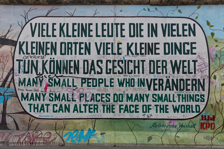 BERLIN, GERMANY - JULY 2015: Berlin Wall graffiti seen on JULY 26, 2015, Berlin, East Side Gallery. It's a 1.3 km long part of original Berlin Wall which collapsed in 1989.のeditorial素材