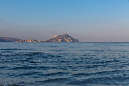 Looking towards Amorgos Island, Greece, seeing a beautiful seascape with deep ocean waters and sunrise cloudscapeの写真素材