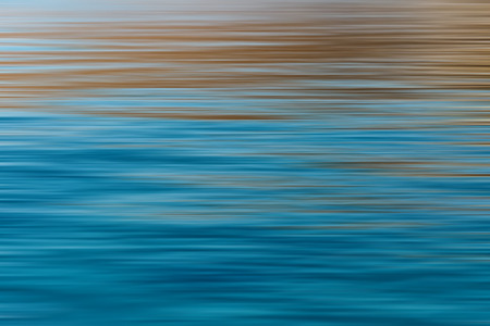 Abstract Ripples in the Ocean with long exposure effect, horizontal motion blurred for backgroundの写真素材