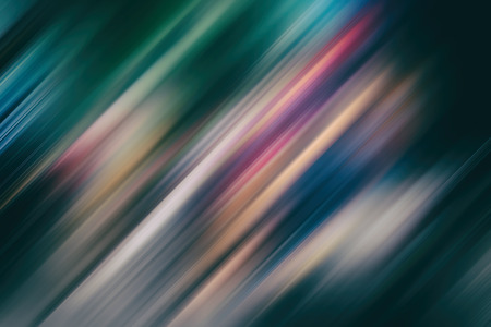 Abstract background with colorful lines at an angle of 45 degrees on a white background with motion blur effectの写真素材