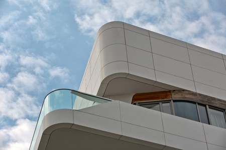 Urban Geometry, looking up to wooden and white metal cladded building. Modern and abstract...