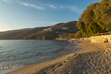 Amorgos Island, Greece - October 2015: Beautiful young and barefoot woman, with short blond hair watching the golden sunset on a Greek Island, Amorgosの写真素材