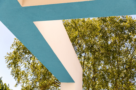 Architectural Corner detail of modern white and blue rendered building with blue skyの写真素材