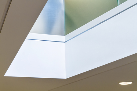 Corner detail of atrium with light reflected from above. Architectural details of premisesの写真素材